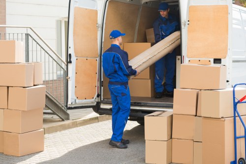Removal team helping with a move in a Fitzrovia street