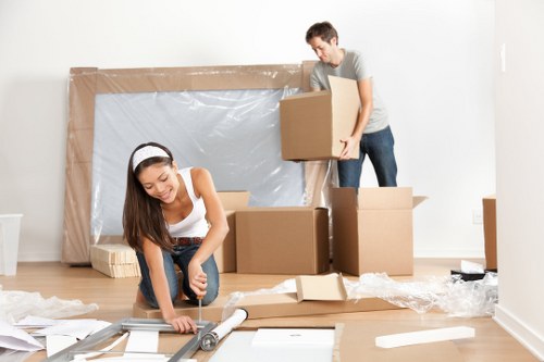 Van moving team loading items safely with protective care