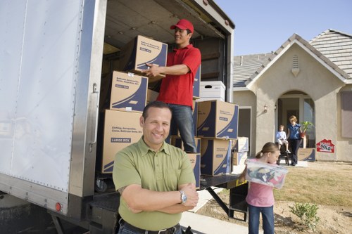 Local moving team handling boxes near Fitzrovia apartments