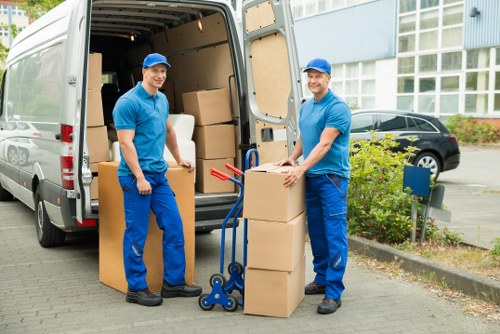 Worker assessing access and handling a move carefully