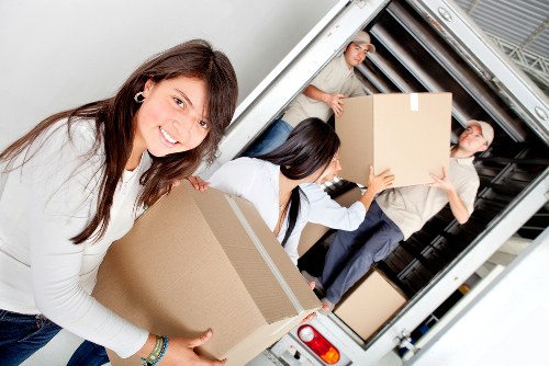 Careful loading of furniture into a moving truck in central London
