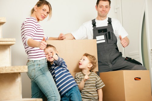 Furniture being carried from a Fitzrovia flat with narrow access